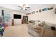 Comfortable living room with couch and large television for Gathering enjoyment at 3875 Grandview Manor Dr, Cumming, GA 30028