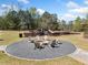 Community playground with swings, slides, benches, and a fire pit area for outdoor enjoyment at 3875 Grandview Manor Dr, Cumming, GA 30028