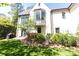 Exterior view of home with well-maintained lawn and tasteful landscaping, complemented by architectural details at 4266 Paces Ferry Road Se, Atlanta, GA 30339