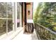 Outdoor balcony with a grill and black metal railing, perfect for enjoying the wooded scenery at 4266 Paces Ferry Road Se, Atlanta, GA 30339
