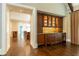 Luxurious bar area with custom cabinetry, lighting, and wine storage at 4266 Paces Ferry Road Se, Atlanta, GA 30339