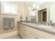 Elegant bathroom features double vanity with stone countertops and a large mirror at 4266 Paces Ferry Road Se, Atlanta, GA 30339