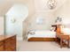 Comfortable bedroom with a bed, hardwood furniture, and a unique arched ceiling at 4266 Paces Ferry Road Se, Atlanta, GA 30339