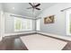 Bright bedroom featuring large windows with plantation shutters and beautiful hardwood floors at 4266 Paces Ferry Road Se, Atlanta, GA 30339