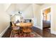 Charming dining room with hardwood floors, unique architecture, and a view to the bathroom at 4266 Paces Ferry Road Se, Atlanta, GA 30339