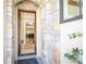 Charming stone archway frames the entrance, offering a glimpse of the home's bright interior at 4266 Paces Ferry Road Se, Atlanta, GA 30339