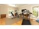 Bright exercise room with a ceiling fan, large windows, and sliding glass doors for ample natural light and access at 4266 Paces Ferry Road Se, Atlanta, GA 30339