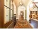Elegant foyer with hardwood floors, chandelier, and view into the living spaces at 4266 Paces Ferry Road Se, Atlanta, GA 30339