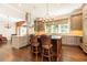 Charming kitchen with stainless appliances, stone counters, and breakfast bar at 4266 Paces Ferry Road Se, Atlanta, GA 30339