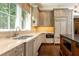 Bright kitchen with stone countertops and a large window bringing in the sunlight at 4266 Paces Ferry Road Se, Atlanta, GA 30339