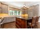 Stylish kitchen with stone countertop and spacious dark wood cabinets at 4266 Paces Ferry Road Se, Atlanta, GA 30339