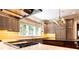Well appointed kitchen with a marble countertops, and light wood custom cabinets at 4266 Paces Ferry Road Se, Atlanta, GA 30339