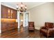 Cozy living room with two armchairs and a cabinet with an entertainment area at 4266 Paces Ferry Road Se, Atlanta, GA 30339
