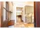 Well-equipped mudroom features custom cabinetry, a utility sink, and durable stone tile flooring at 4266 Paces Ferry Road Se, Atlanta, GA 30339
