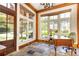 Sunlit office with hardwood trim, stone floors, and large windows offering serene outdoor views at 4266 Paces Ferry Road Se, Atlanta, GA 30339