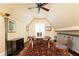 Bright office space with a large desk, custom built-ins, a ceiling fan, and arched ceilings at 4266 Paces Ferry Road Se, Atlanta, GA 30339