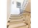 Close up of carpeted staircase with decorative iron railings leading to the upper level at 4266 Paces Ferry Road Se, Atlanta, GA 30339