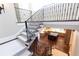 Elegant staircase with wrought iron railings and view of the kitchen at 4266 Paces Ferry Road Se, Atlanta, GA 30339