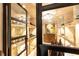 Wine Cellar with Brick Shelving and Glass Door at 4266 Paces Ferry Road Se, Atlanta, GA 30339