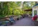 Spacious wooden deck perfect for entertaining with outdoor seating at 7522 Greens Mill Dr, Loganville, GA 30052