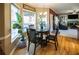 Cozy breakfast nook featuring a table and chairs, surrounded by windows offering natural light and backyard views at 7522 Greens Mill Dr, Loganville, GA 30052