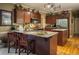 Stylish kitchen featuring granite countertops, stainless steel appliances, and a convenient breakfast bar for casual dining at 7522 Greens Mill Dr, Loganville, GA 30052