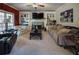 Inviting living room featuring a fireplace flanked by built-in bookshelves and cozy sofas at 7522 Greens Mill Dr, Loganville, GA 30052