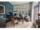 Well-lit home office with built-in shelving showcasing a collection of figurines and memorabilia at 7522 Greens Mill Dr, Loganville, GA 30052