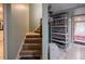 Carpeted staircase with display shelves nearby at 7522 Greens Mill Dr, Loganville, GA 30052