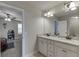 Bathroom with dual sinks, granite countertop, and ample cabinet space at 110 Legion Dr, Buford, GA 30518