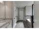 Bathroom with granite countertop, tile flooring, and dark hardware at 110 Legion Dr, Buford, GA 30518