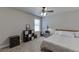 Cozy bedroom featuring neutral tones, a ceiling fan, and a window that lets in natural light at 110 Legion Dr, Buford, GA 30518