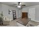 Bedroom featuring natural light, desk, decorative ladder, and neutral tones at 110 Legion Dr, Buford, GA 30518