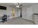This bedroom has a ceiling fan, gray walls, and natural light at 110 Legion Dr, Buford, GA 30518