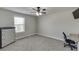 Bedroom featuring gray walls, a ceiling fan, and a window for natural light at 110 Legion Dr, Buford, GA 30518