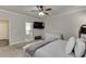 Gray bedroom featuring a TV, ensuite bathroom, and neutral decor at 110 Legion Dr, Buford, GA 30518