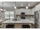 Bright kitchen with granite countertops, stainless steel appliances, and white cabinetry at 110 Legion Dr, Buford, GA 30518