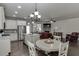Open-concept kitchen and living area featuring a dining table at 110 Legion Dr, Buford, GA 30518