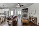 Cozy living area with stone fireplace, hardwood floors, and comfortable seating, perfect for relaxing and entertaining at 110 Legion Dr, Buford, GA 30518