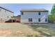 Well-maintained two-story home with a covered patio, spacious backyard, and a wooden fence for added privacy at 110 Legion Dr, Buford, GA 30518