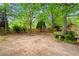 Large backyard with beautiful landscaping and fenced perimeter, perfect for outdoor activities at 203 Setters Rdg, Canton, GA 30115