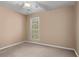 This cozy bedroom with neutral walls is perfect for relaxation and rest, with a large window for natural light at 203 Setters Rdg, Canton, GA 30115