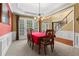 Inviting dining room with large windows and a view to the staircase at 203 Setters Rdg, Canton, GA 30115
