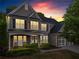 Stately two-story home with manicured landscaping, inviting front porch, and a large garage at 203 Setters Rdg, Canton, GA 30115