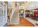 Grand two-story foyer with hardwood floors, staircase, and open view to the living spaces at 203 Setters Rdg, Canton, GA 30115