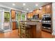 Bright kitchen with a center island, stainless appliances, and direct access to the backyard at 203 Setters Rdg, Canton, GA 30115