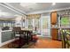 Cozy kitchen nook with wood floors, natural light, and easy access to the outdoor space at 203 Setters Rdg, Canton, GA 30115