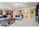 Spacious living room offering neutral decor and views of the foyer and entryway at 203 Setters Rdg, Canton, GA 30115