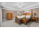 Spacious main bedroom suite with carpet, tray ceiling, natural light, and ample closet space at 203 Setters Rdg, Canton, GA 30115