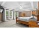 Large main bedroom with trey ceiling, large windows, carpet, and natural light at 203 Setters Rdg, Canton, GA 30115